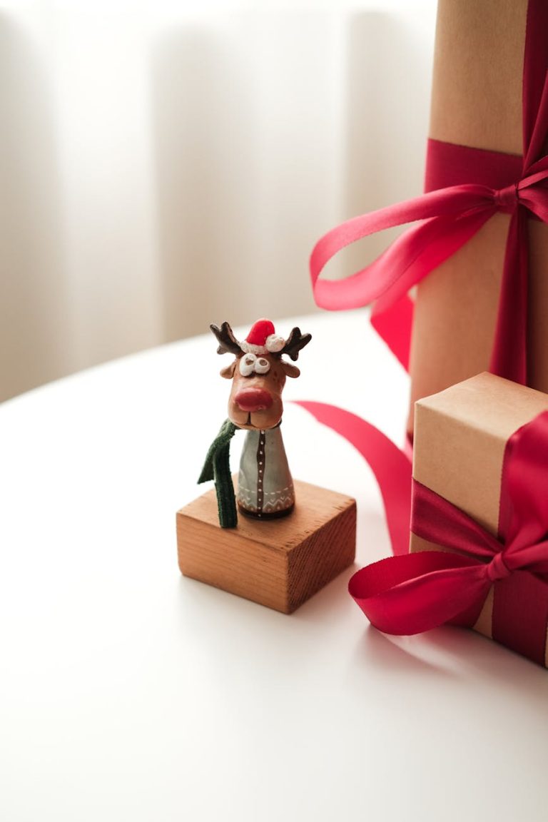 festive reindeer figurine with gift boxes